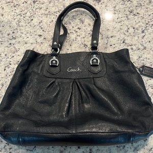 Coach black shoulder bag with purple satin interior